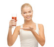woman holding glass of tomato juice