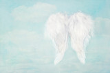 Fototapeta Uliczki - White angel wings on blue sky background
