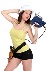 Woman holding electric saw