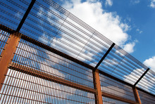 Security Fence Against Blue Sky