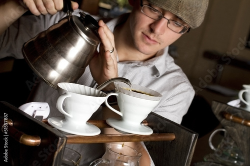 Fotografie, Obraz a coffee house employee brew a single cup of coffee