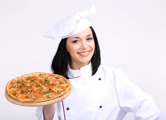 Canvas Print - Beautiful girl chief-cooker with pizza isolated on white