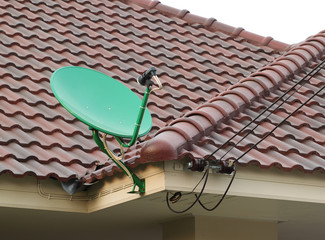 Wall Mural - Satellite dish on the roof of tile