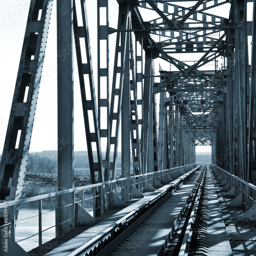 Naklejka ścienna Old vintage railway bridge over river