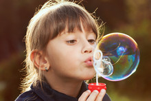 Little Girl Inflates A Big Bubble