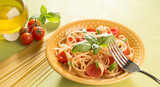 Fototapeta Tulipany - Dish with spaghetti  tomatoes and basil