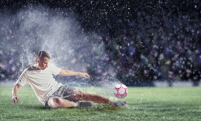 Wall Mural - football player striking the ball