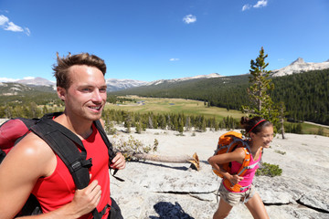 Wall Mural - People hiking - young hiker couple in Yosemite