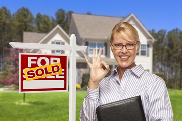 Wall Mural - Real Estate Agent in Front of Sold Sign and House