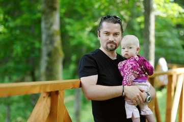 Wall Mural - Young father and his little daughter