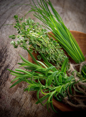 Fresh herbs on wooden table