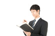 © masa1986 - 手帳を持った男性
