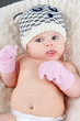 Baby with tuque and mittens