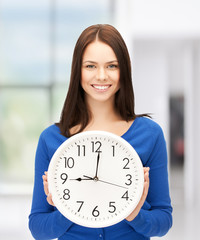 businesswoman with wall clock