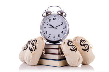 Wall Mural - Sacks of money and alarm clock on white