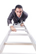 © Elnur - Businessman climbing the ladder isolated on white