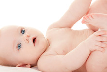Cute Baby With Beautiful Blue Eyes On The White Background