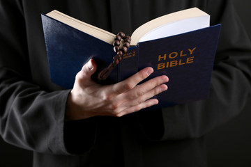 Canvas Print - Priest reading from the holy bible, close up