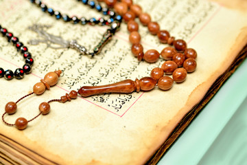 Muslim rosary beads on the Holy Quran