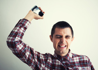 Poster - Angry businessman throwing his mobile phone