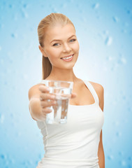 Poster - young smiling woman with glass of water