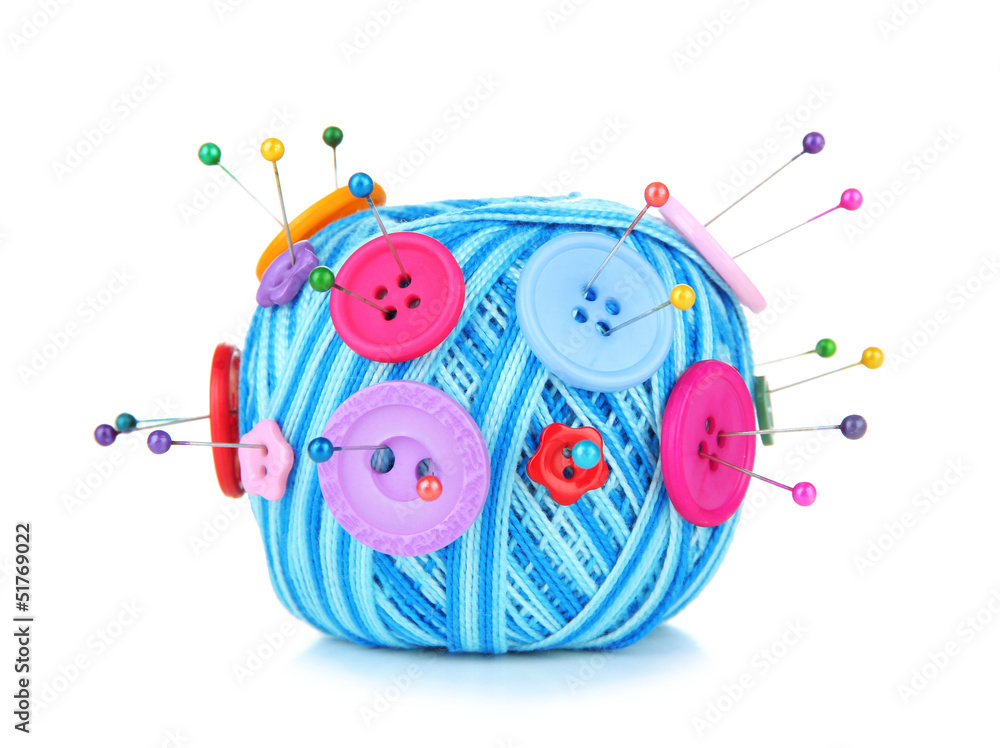 Colorful buttons and wool balls, isolated on white