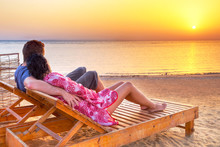Couple In Hug Watching Together Sunrise Over Red Sea In Egypt