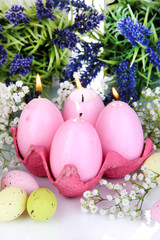  Easter candles with flowers close up