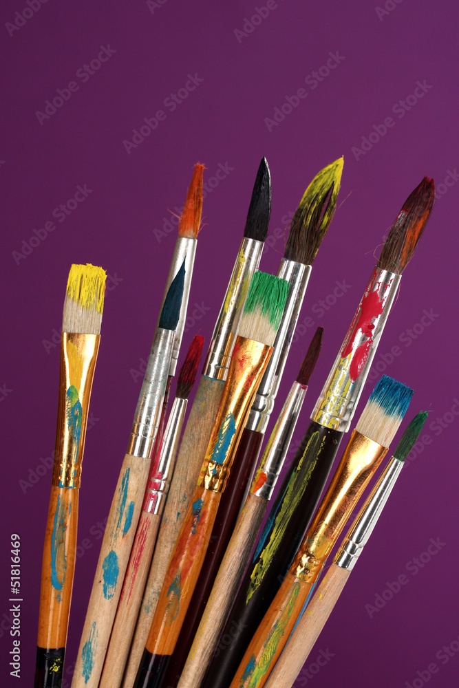 Many brush in paint on purple background