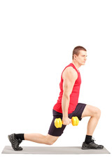 Sticker - Full length portrait of a young man exercising with weights