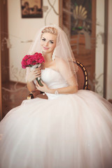 Wall Mural - Beautiful bride in wedding dress with bouquet bridal flowers