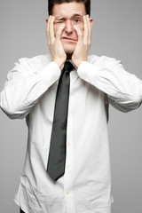 Wall Mural - Businessman in white shirt expressing problems.