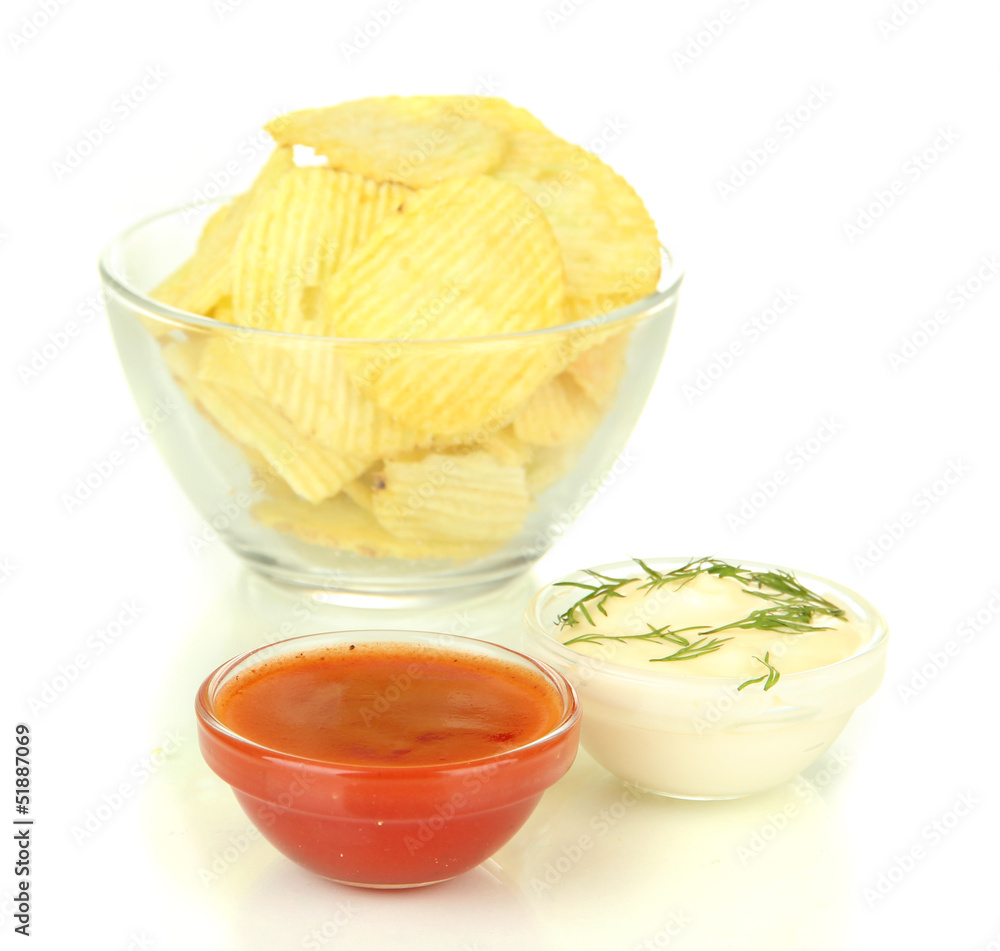 Potato chips in glass bowl and sauces, isolated on white