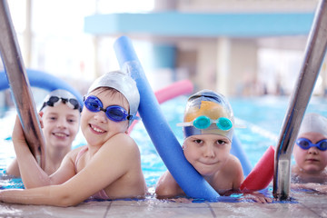 Canvas Print - happy children group  at swimming pool