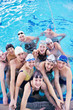 © .shock - happy children group  at swimming pool