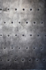 Black metal plate or armour texture with rivets