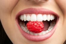 Perfect Teeth Biting Raspberry.