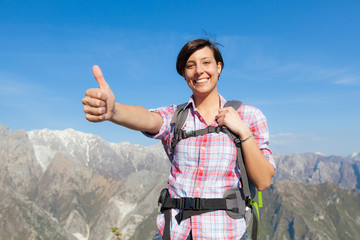 Poster - Young Woman with Thumbs Up at Top of Mountain