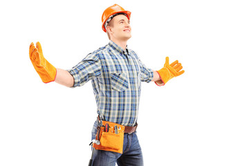 Canvas Print - Happy manual worker with helmet spreading arms