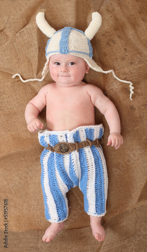 Naklejka na meble Little viking in handmade knitted costume.