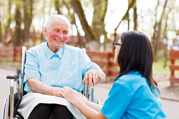 Wall Mural - Doctor, Nurse Talking With Kind Lady