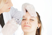 Young Woman Getting Botox In Her Frown