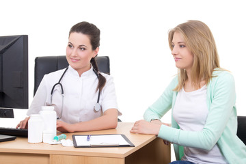 female doctor explaining results to young patient in office