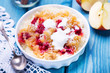 Rice pudding with applem raspberry and cinnamon