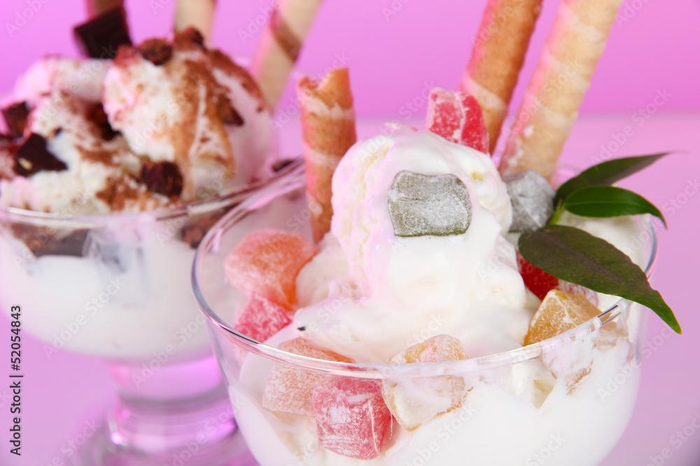 Ice cream with wafer sticks on pink background