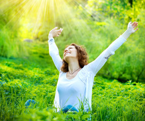 Wall Mural - beautiful young woman outdoors. enjoy nature