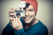 © Eugenio Marongiu - young stylish man holding old camera