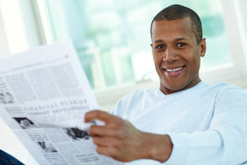 Guy reading newspaper