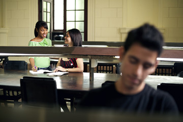 Young people at school, students studying in college library