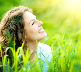 Wall Mural - beautiful young woman outdoors. enjoy nature